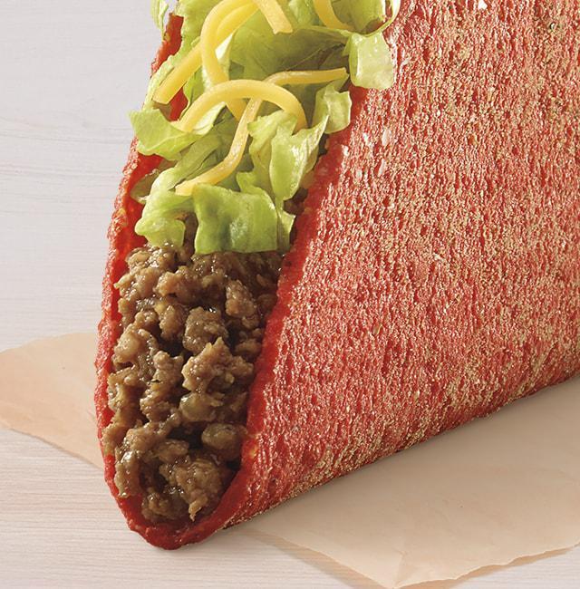 Flamin' Hot® Cool Ranch® Doritos® Locos Tacos · A Flamin’ Hot® Cool Ranch® Doritos® Locos Tacos shell filled with seasoned beef, lettuce, and cheddar cheese.