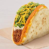 Doritos® Cheesy Gordita Crunch - Nacho Cheese · A Nacho Cheese Doritos® Locos Tacos wrapped up in a soft piece of flatbread with Seasoned Be...