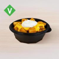 Cheesy Fiesta Potatoes · Crispy potato bites topped with reduced-fat sour cream and nacho cheese sauce.