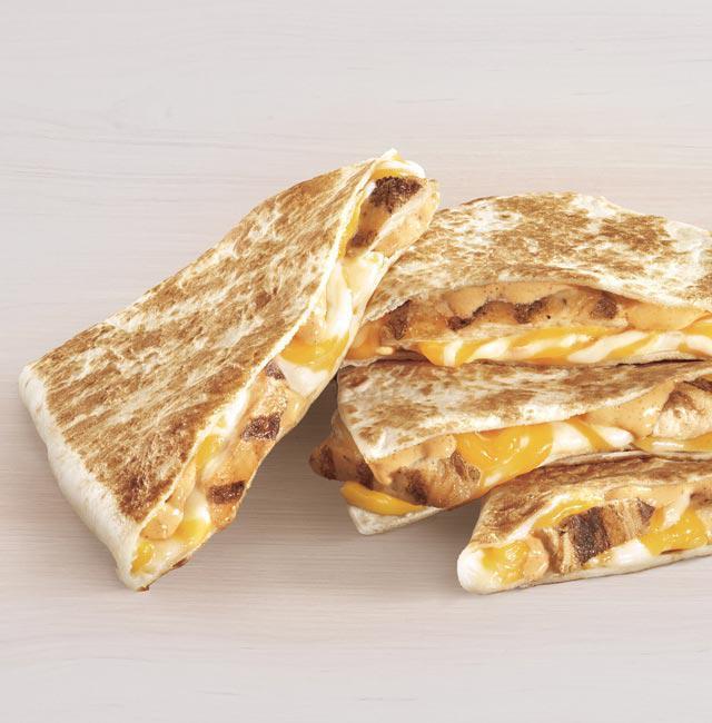 Chicken Quesadilla · An extra flour tortilla filled with melty three-cheese blend, fire grilled chicken, creamy jalapeño sauce folded and grilled to perfection.