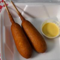 2 Pieces Corn Dog · Battered and deep fried sausage on a stick. 