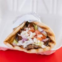 Lamb Gyro · Rotisserie marinated boneless lamb sliced with gyro sauce, lettuce, tomatoes and onions all ...