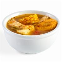 Caribbean Chicken Soup  · A steaming bowl of chicken soup made with corn, yuca, pumpkin, plantains, and grilled chicke...