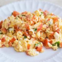 Huevos Pericos, Tostada y Cafe con Leche · Scrambled eggs with tomato, ham, green peppers and onions with coffee with milk.