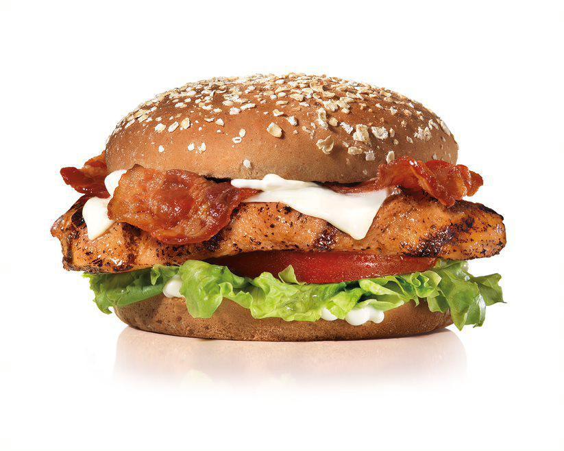 Charbroiled Chicken Club Sandwich · Charbroiled Chicken Breast, Two Strips of Bacon, Melted Swiss Cheese, Lettuce, Tomato and Mayonnaise on a Honey Wheat Bun.