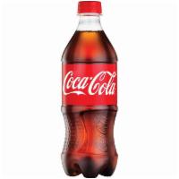 Coke · 16.9 fl oz bottle of Coke.