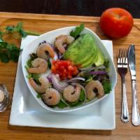 Caribbean Salad · Shrimp sauteed to perfection, fresh mixed greens, thinly sliced red onions, avocado and pine...
