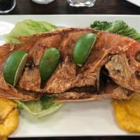 Whole Snapper · Served with Coconut Rice, Fried Green Plantains and Salad