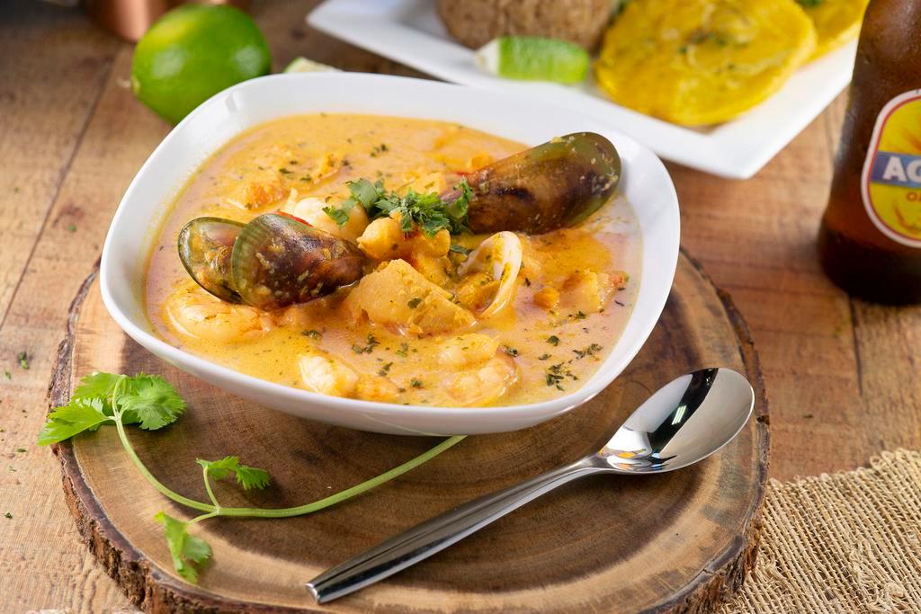 Cazuela De Mariscos · From the Caribbean of Colombian, this traditional seafood casserole is made fresh to order. served with Coconut Rice, Fried Green Plantains and Salad