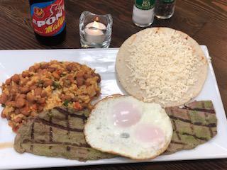 Calentado Campesino · Rice mixed with red beans, sauteed onions. Steak with two fried eggs includes a Colombian corn cake topped shredded white cheese.