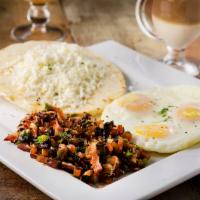 Huevos Campesino · Fried eggs topped with sauteed onions, tomatoes, mushrooms and bacon includes a Colombian co...
