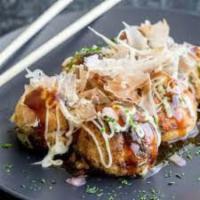 Takoyaki · Fried dough balls with octopus topped with sweet and tangy brown sauce, sweet Japanese mayo,...