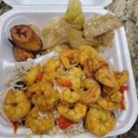 Curry Shrimp Meal · Served with rice and beans, peas, cabbage, and plantains.