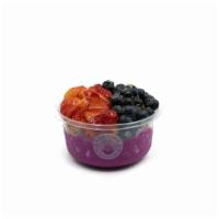 Dragonberry- Pitaya Bowl · Pitaya blend topped with granola, strawberry, blueberry, and honey.
