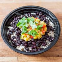 Black Bean Mango Bowl · Coconut brown rice, topped with homemade black beans fresh mango salsa, pickled onions and p...