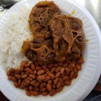 7. Rabo de Res Guisada · Beef oxtail. Choice of rice and beans, salad, steam vegetable, green plantain or french fries.