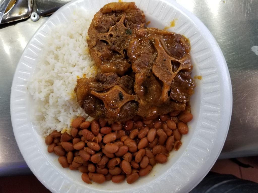 7. Rabo de Res Guisada · Beef oxtail. Choice of rice and beans, salad, steam vegetable, green plantain or french fries.