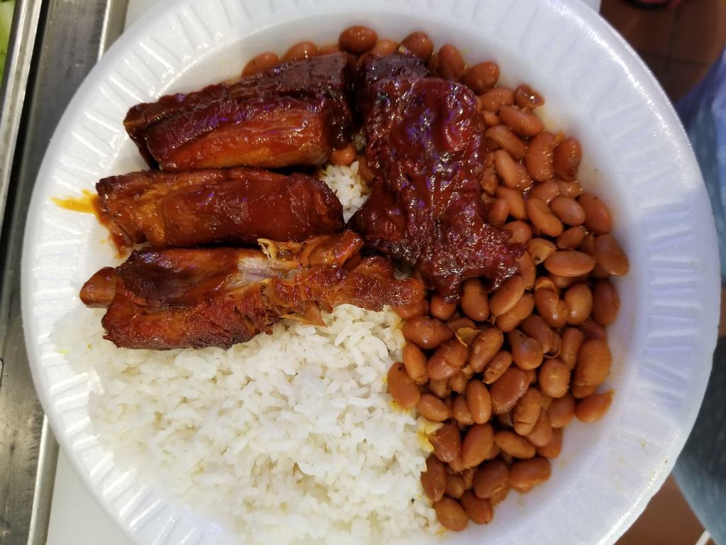 Costilla BBQ  Horno Platter · Baked ribs. Choice of rice and beans, salad,  or steamed vegetables.
