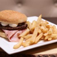 Hornitos Hamburger · Quail eggs, ham, cheese, lettuce, tomato and onions with french fries.
