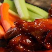 Sweet Red Chili Wings · This sauce starts off sweet, but spicy red chili peppers provide enough heat to fire up an o...