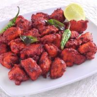 Chilli Chicken · Stir fried chicken with sweet peppers, green chillies, onions and aromatic Indian herbs.