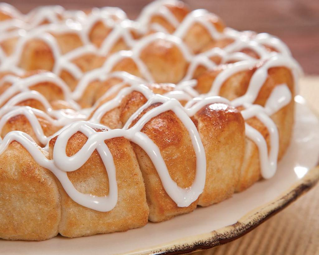 Cinnamon Monkey Bread · Others try, but no one can copy our bite-sized pieces of oven-baked dough sprinkled with sweet cinnamon and sugar, then drizzled with decadent Icing.