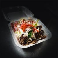 Gyro over rice  · Sliced lamb meat served over rice with lettuce tomato onion with white sauce 