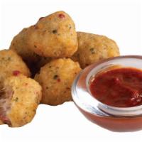 Pepperoni Pizza Bites · Breaded pizza bites stuffed with pepperoni and cheese, served with marinara dipping sauce.
R...