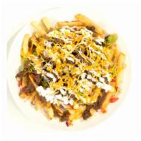 Carne Asada Fries · French fries, your choice of meat, beans, guacamole, pico de gallo, sour cream and cheese