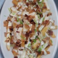 Loaded Fries · Applewood smoked bacon, our white 4 cheese sauce, smoked mozzarella topped with scallions.