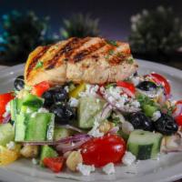 Mediterranean Grilled Salmon Salad · Cucumber, peppers, red onions, olives, feta cheese, chickpeas, herbed vinaigrette
