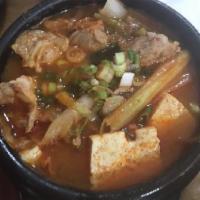 15. Kimchi Jjigae · Our kimchi soup contains various of vegetables, tofu and pork. Spicy. 
