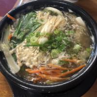 16. Dook-Bae Gi Bulgogi · Bulgogi stew contains rice cake, glass noodles and it's topped with scallions.