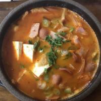 19. Budae Jjigae · Soldier stew is famous here, it contains sausage, ham, spam and various of vegetables. Spicy...