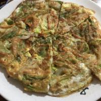 45. Pajeon · Pancake contains various of vegetables like onion, green onion, carrots and eggs.