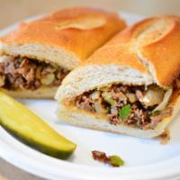 Philly Cheese Steak Sandwich · Premium shredded beef served on hero with melted American cheese. Chopped onions and green p...