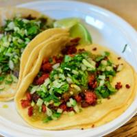 Soft Taco (order of 2) · Choice of chicken, steak, pork tacos. Comes with spicy Mexican sauce, chopped onions and cil...