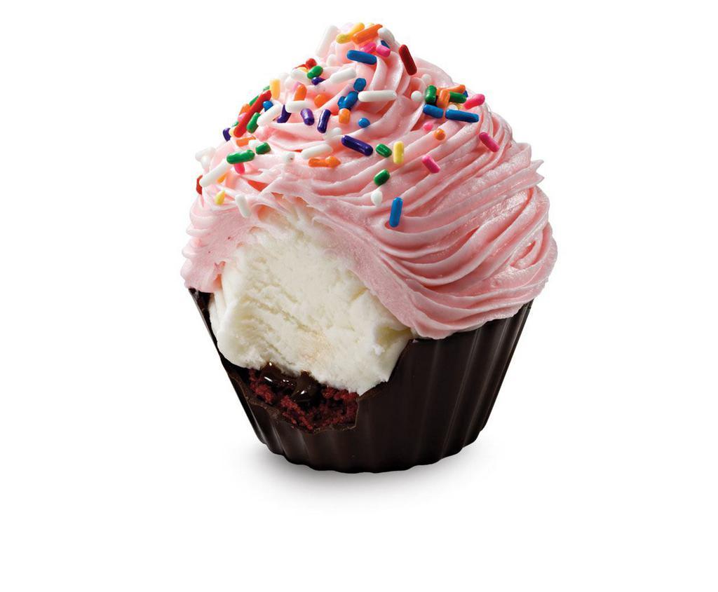 Cake Batter Delux Cupcake · a rich chocolate cup filled with a layer of red velvet cake, fudge and cake batter ice cream topped with fluffy pink frosting and rainbow sprinkles