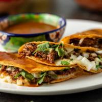 3 Birria Tacos with Consume · Birria served with your choice of either Brisket or Chicken, mozzarella cheese, onions, cila...