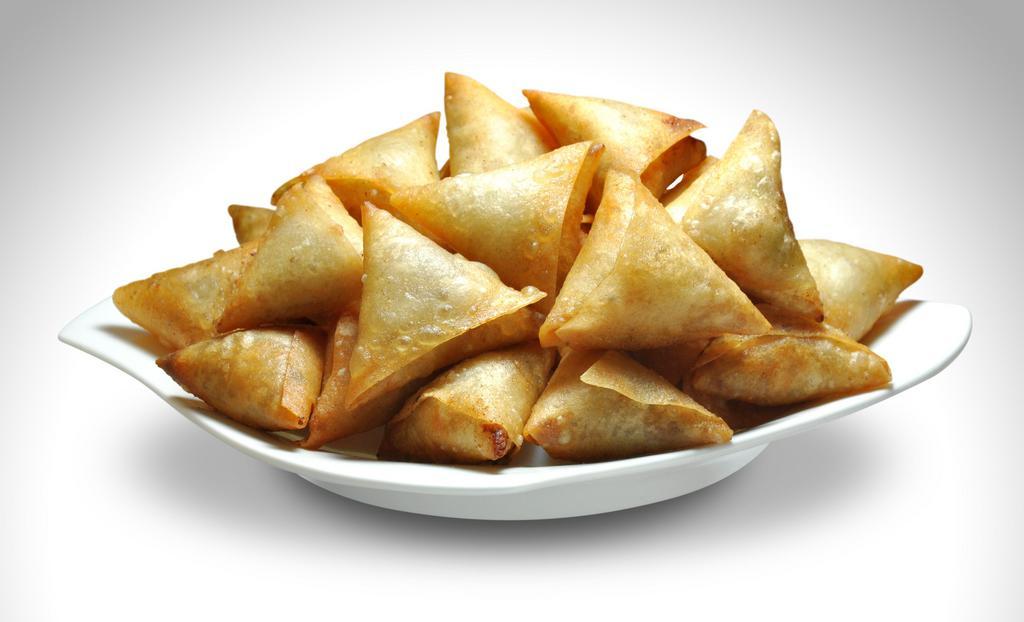 Chicken Samosa · Crispy pastry made with minced chicken, onions, ginger and some spices.