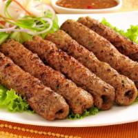Chicken Seekh Kabab · Oven-baked minced chicken skewers seasoned with onion, garlic, coriander, cumin and exotic
s...