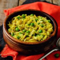 Gobi Mutter · Crispy cabbage stirred with green peas and cumin seeds.