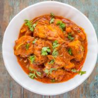 Chicken Vindaloo · From the Portuguese comes this fiery chicken dish with black peppercorns and vinegar.