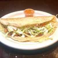 Al Pastor Quesadilla · Roast pork. Served with lettuce, onion, cheese and sour cream. 