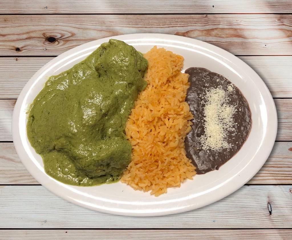 Pipian Verde de Pollo · Chicken with green sauce served with rice, beans and tortillas.