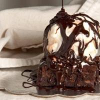 Brownie Sundae · Our famous Mexican vanilla ice cream on top of one of our homemade savory brownie from our b...