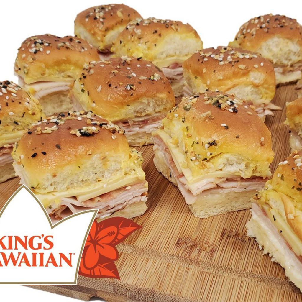 Deli Hawaiian Turkey Sliders, 12 Ct. · King's Hawaiian rolls, oven roasted turkey, Swiss cheese, mayo, deli style mustard, dill pickles, garlic butter spread, everything bagel seasoning. Note: this item requires 12 min in oven. Full instructions will be included.