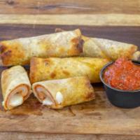 Pizza Logs · Pepperoni and mozzarella, with a crisp shell and marinara dipping sauce.