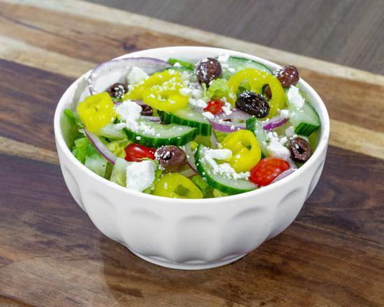 Greek Salad · Romaine, feta, Kalamata olives, tomato, red onion, banana peppers, and Greek dressing.