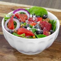 Berry Spinach Salad · Spinach, toasted walnuts, red onion, goat cheese, strawberries, blueberries, and citrus vina...